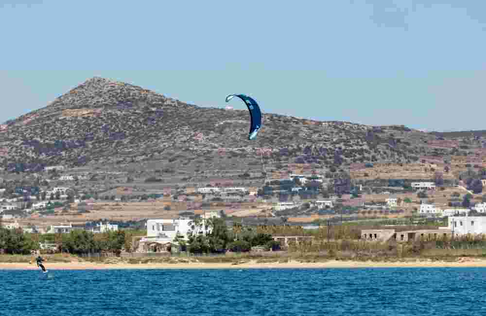 Kitesurfing kiteboarding in Aegean sea at Pounta beach, Paros island Cyclades destination Greece.