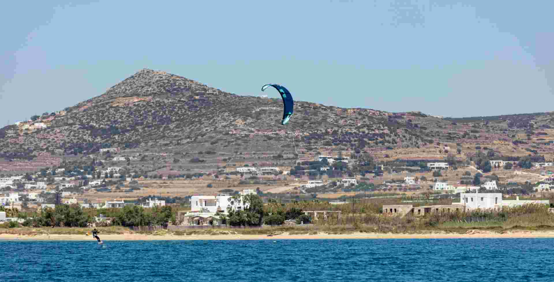 Kitesurfing kiteboarding in Aegean sea at Pounta beach, Paros island Cyclades destination Greece.