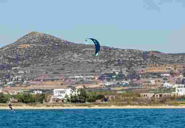 Kitesurfing kiteboarding in Aegean sea at Pounta beach, Paros island Cyclades destination Greece.