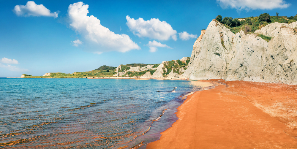 Colorful spring landscape of famous Xi Beach. Bright morning scene of Cephalonia island, Greece, Europe. Splendid seascape of Ionian Sea. Traveling concept background.