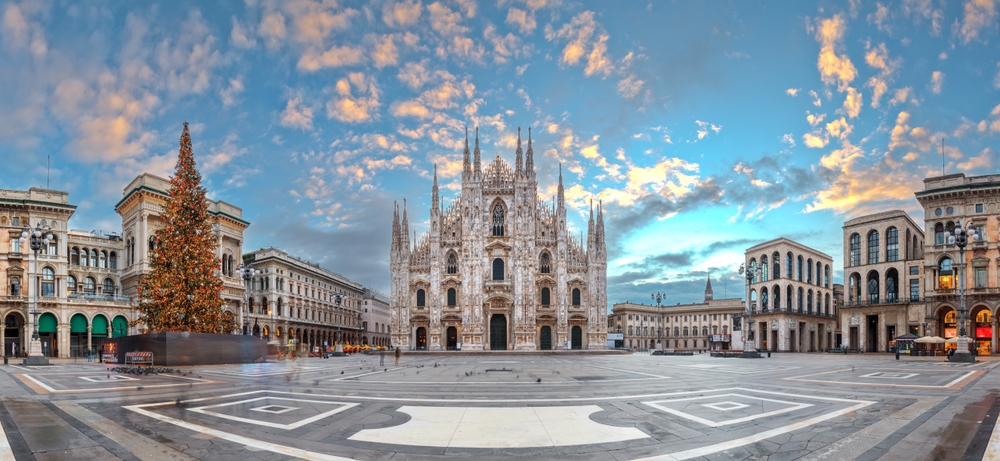 Milan Cathedral (Duomo di Milano) and Christmas tree in Piazza del Duomo during the winter holiday season