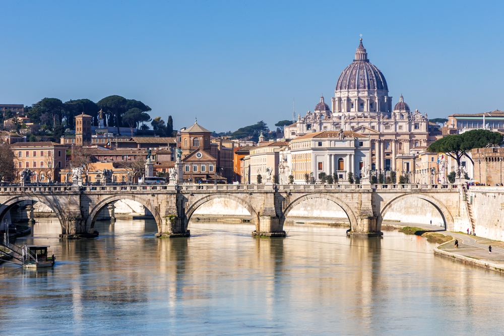 View of St. Peter’s Basilica and Ponte Sant’Angelo spanning the Tiber River in Rome