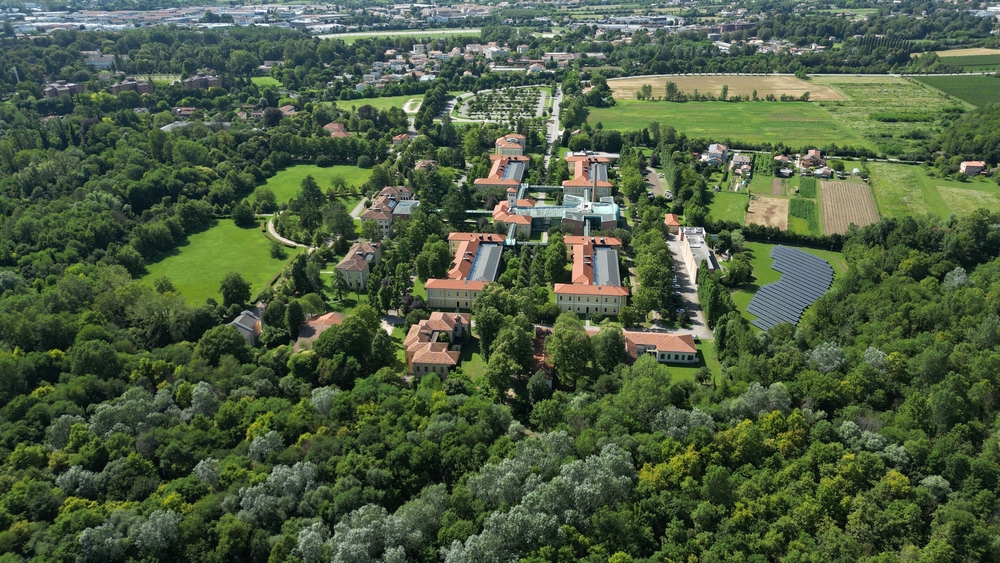Aerial view of the University of Padua Botanical Garden surrounded by lush greenery and countryside