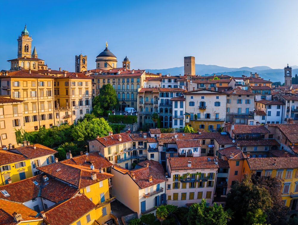 Panoramic view of Bergamo’s historic upper town with terracotta rooftops and church domes