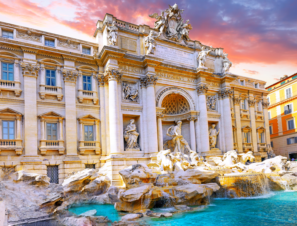 The Trevi Fountain in Rome featuring intricate Baroque sculptures and crystal-clear turquoise water