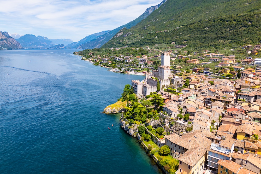 Aerial view of Limone sul Garda on Lake Garda with historic buildings, mountain scenery and waterfront views 