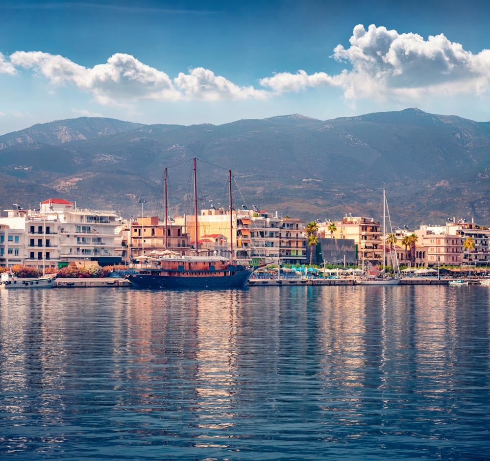 Old wooden sailboat in the port of Kalamata. Splendid summer seascape of Ionian sea. Spectacular outdoor scene of Peloponnese peninsula, Greece, Europe. Traveling concept background.